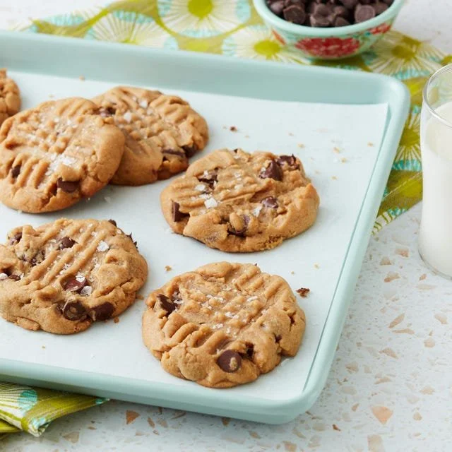 Freshly baked peanut butter chocolate chip cookies on a plate