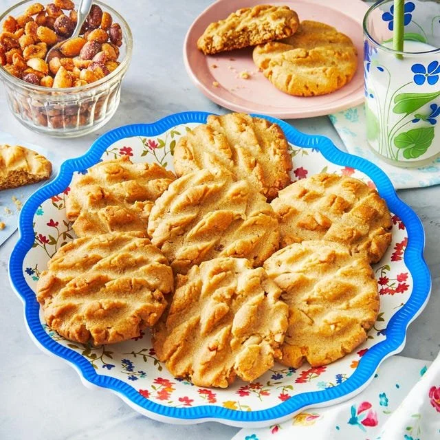 Freshly baked peanut butter cookies on a cooling rack