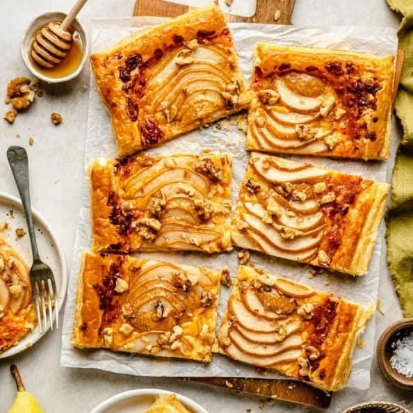 Pear, Walnut & Cheddar Puff Pastry Tart on a rustic wooden table