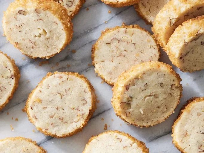 Freshly baked Pecan Shortbread Cookies on a plate, ready to enjoy.
