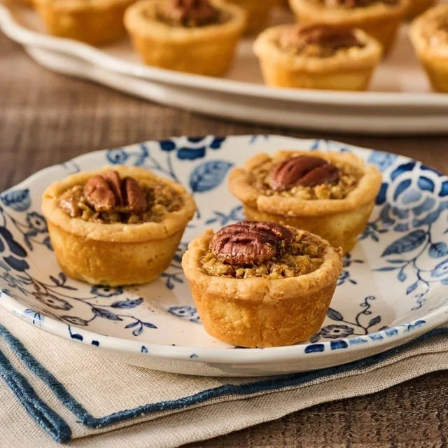 Delicious pecan tassies, mini pecan pies in flaky pastry shells