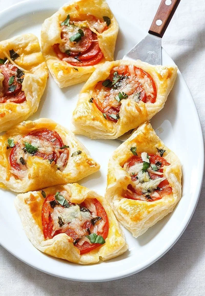 Delicious Pepperoni Basil Tomato Puffs on a plate, perfect for snacks