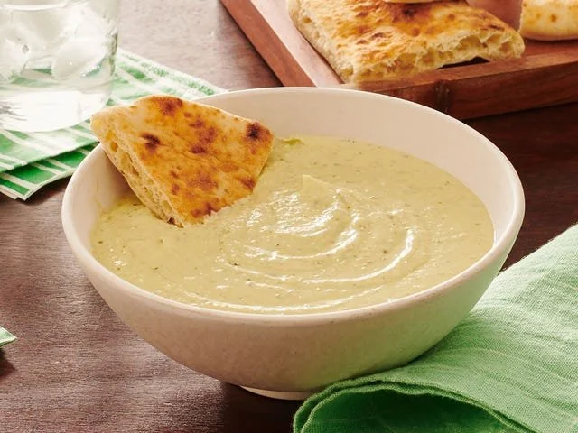 Delicious Pesto Feta Dip served with fresh vegetables and crackers