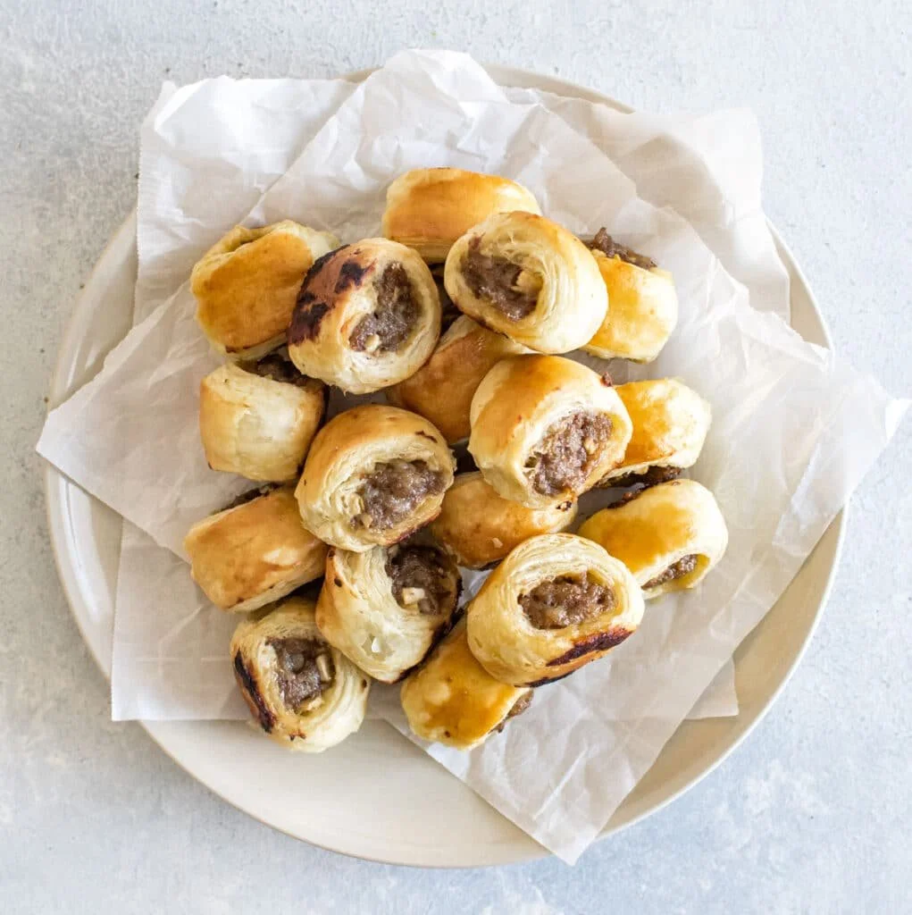 Delicious homemade pork sausage rolls on a platter