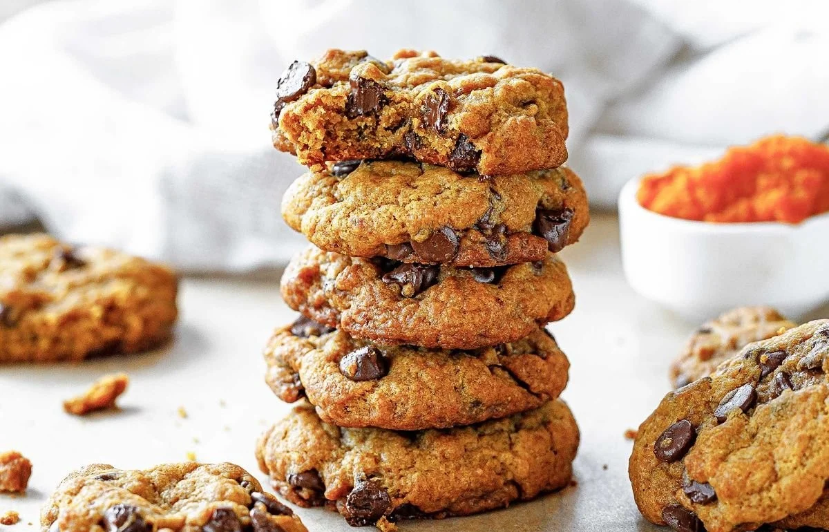 Freshly baked Pumpkin Chocolate Chip Cookies on a cooling rack