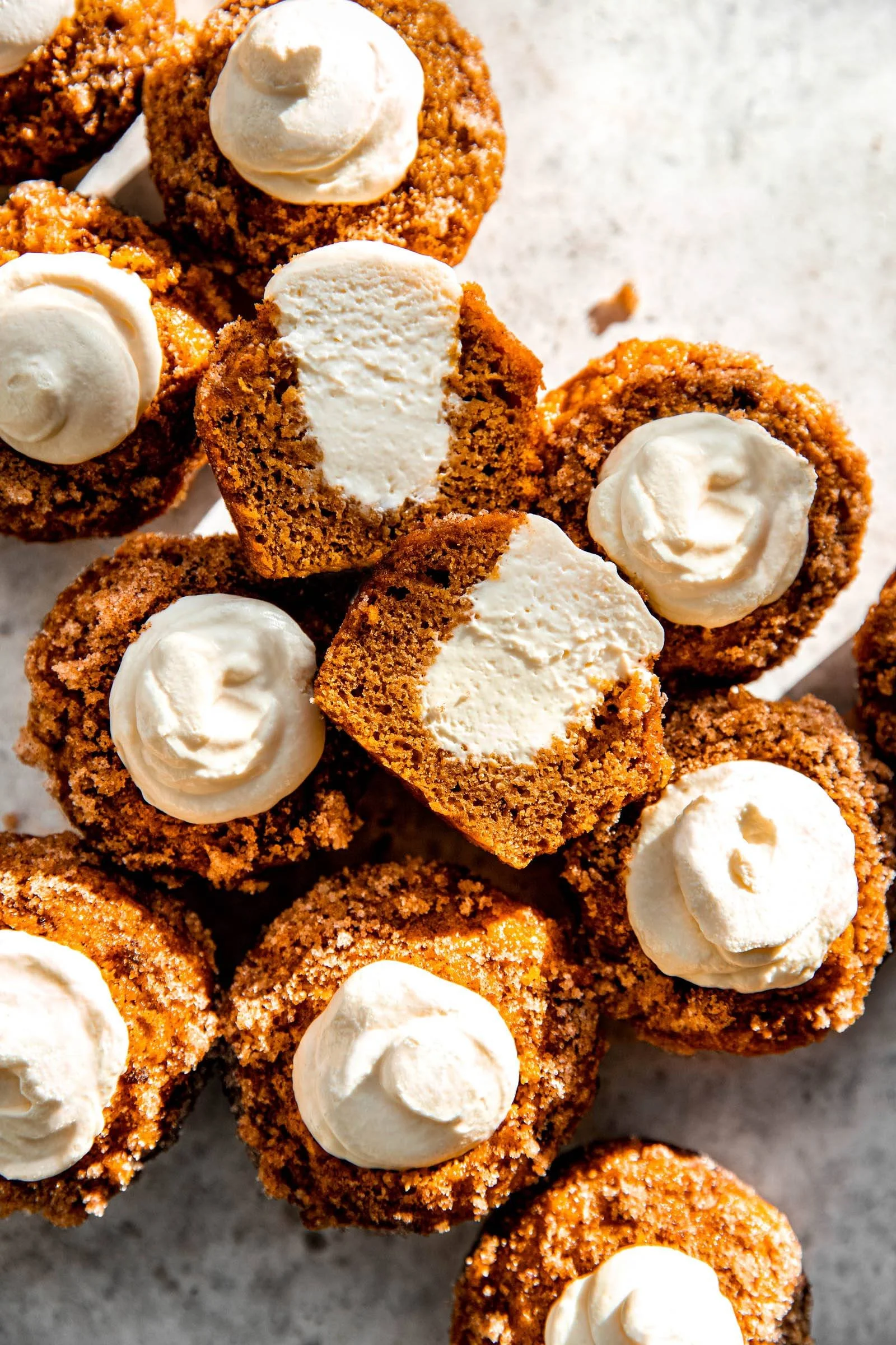 Delicious pumpkin muffins with maple cream cheese frosting perfect for fall.