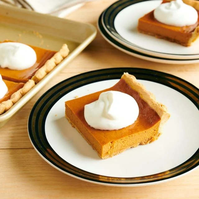 Delicious pumpkin slab pie served with whipped cream