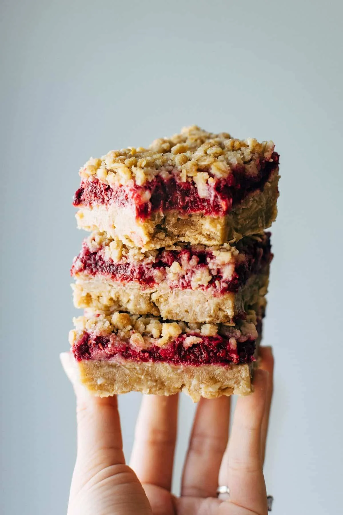 Freshly baked Raspberry Crumble Bars with a buttery topping and ripe raspberries