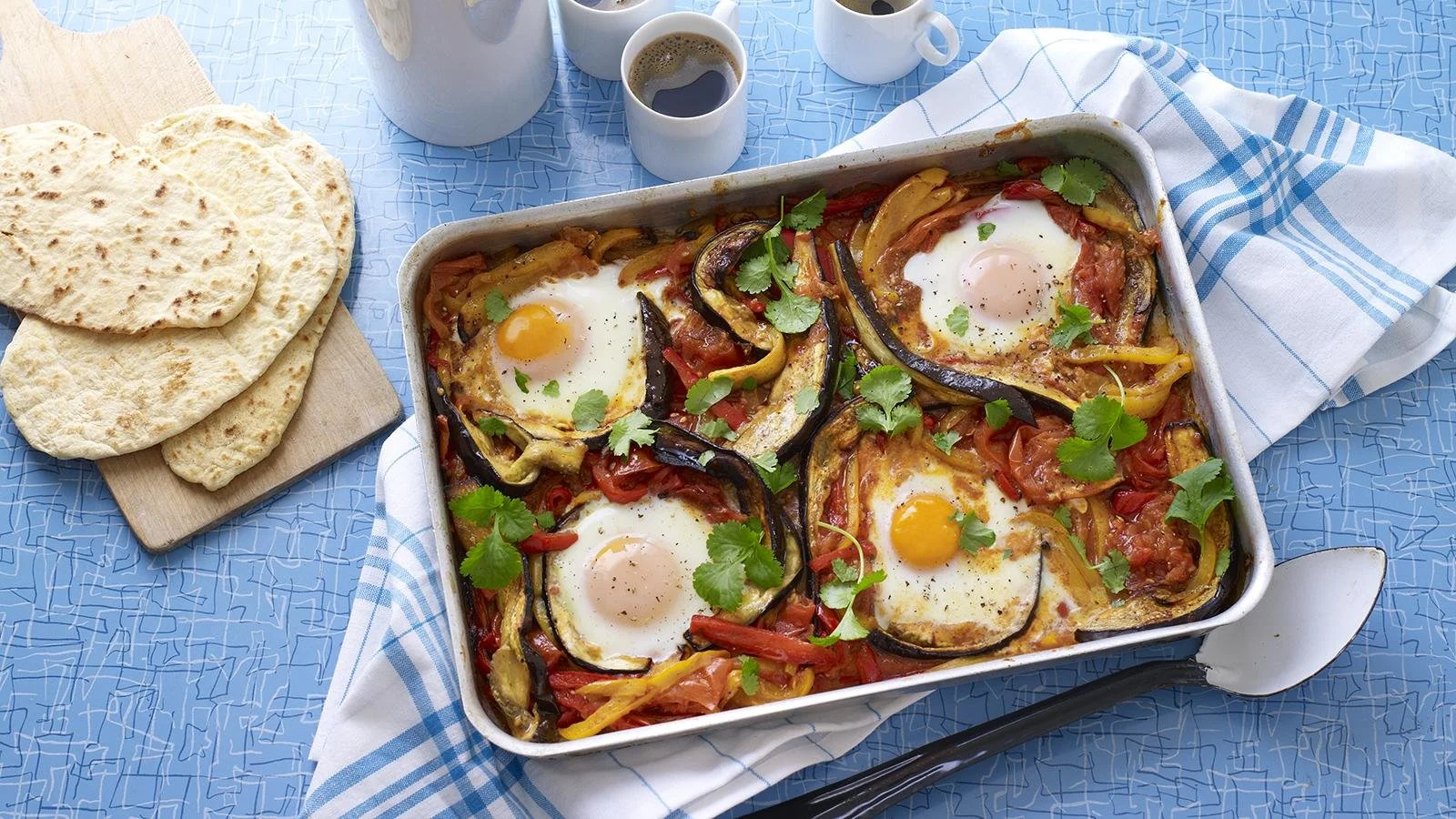 Delicious shakshuka traybake with eggs and spices in a vibrant dish.