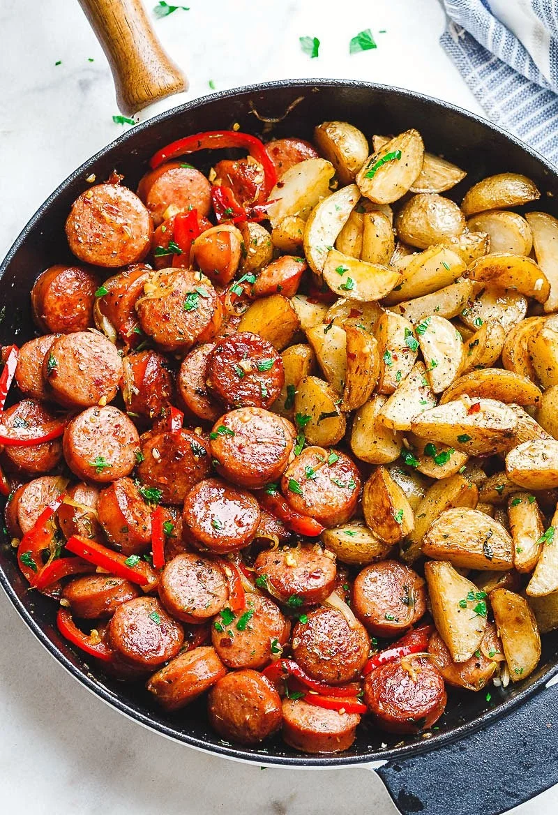 Smoked sausage and potato skillet cooked in a cast iron pan