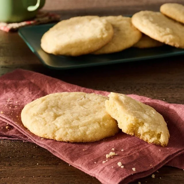 Freshly baked soft sugar cookies on a cooling rack