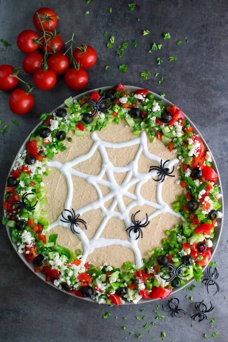 Spooky Spider Web Halloween Hummus Dip served in a festive bowl