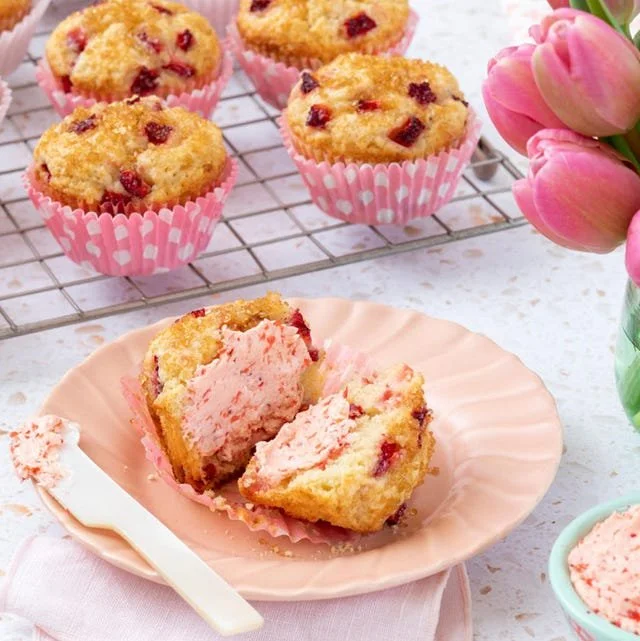Freshly baked strawberry muffins with juicy strawberries and a golden crust.