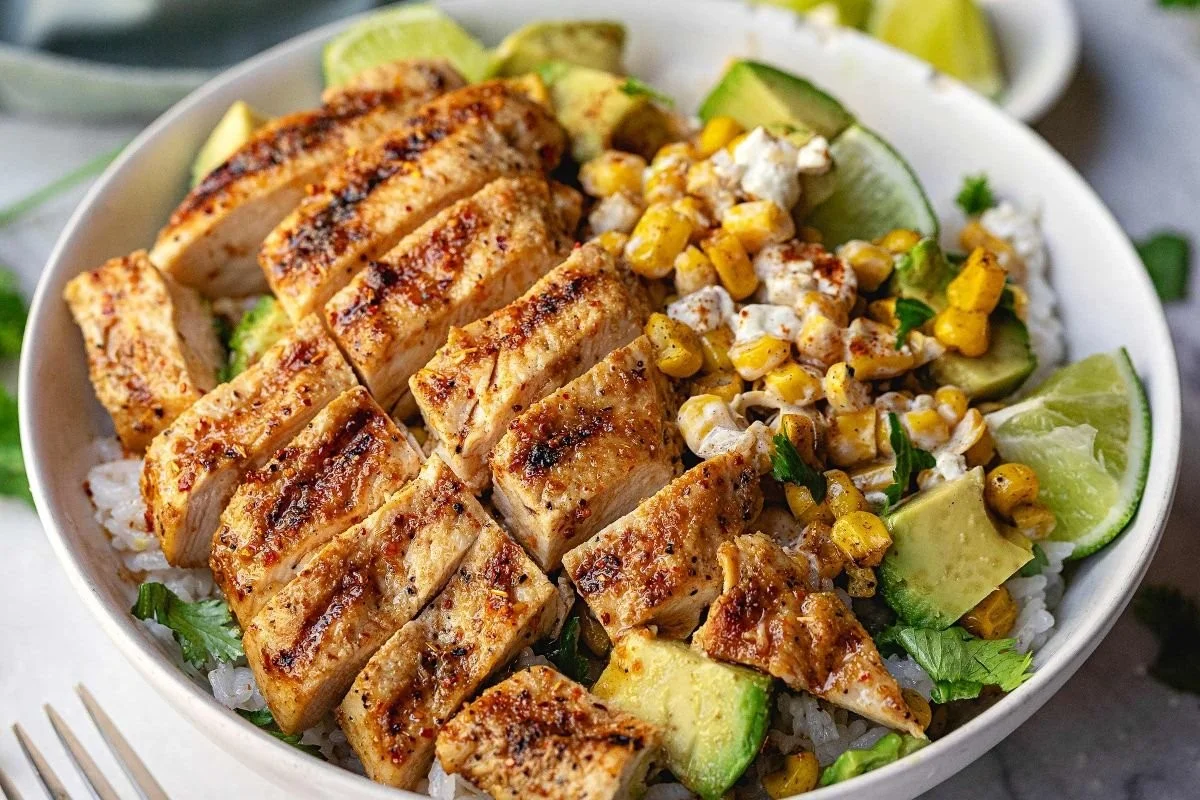 Delicious street corn chicken rice bowls topped with vibrant flavors