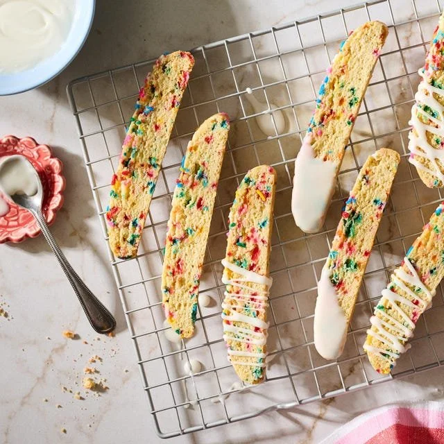 Delicious homemade sugar cookie biscotti on a rustic wooden tray.
