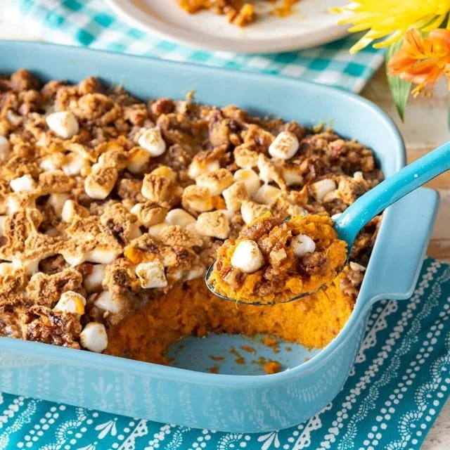 Delicious sweet potato casserole topped with marshmallows and pecans