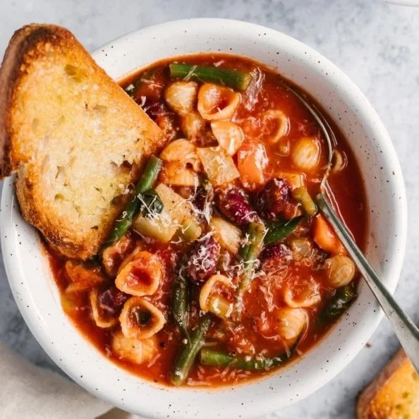 Bowl of the best minestrone soup with fresh vegetables and pasta.