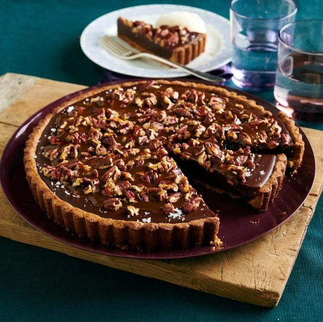 Delicious Turtle Tart with chocolate, caramel, and nuts