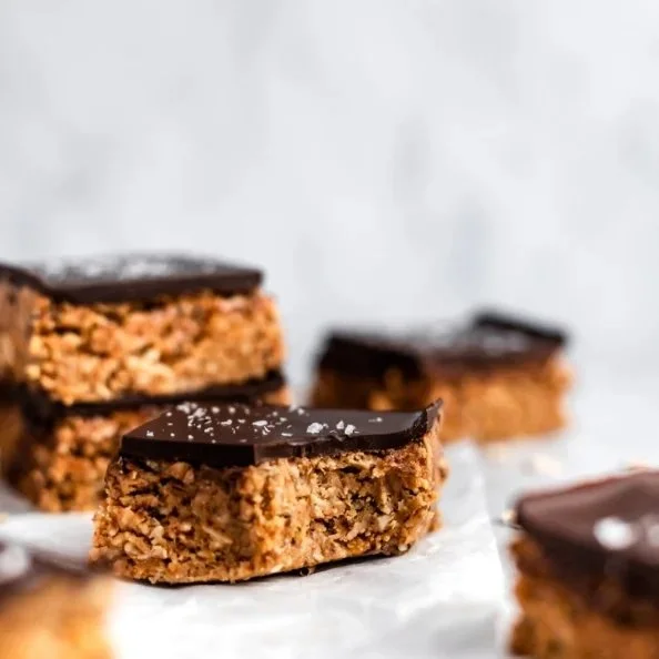 Vegan no bake chocolate peanut butter oatmeal bars on a plate