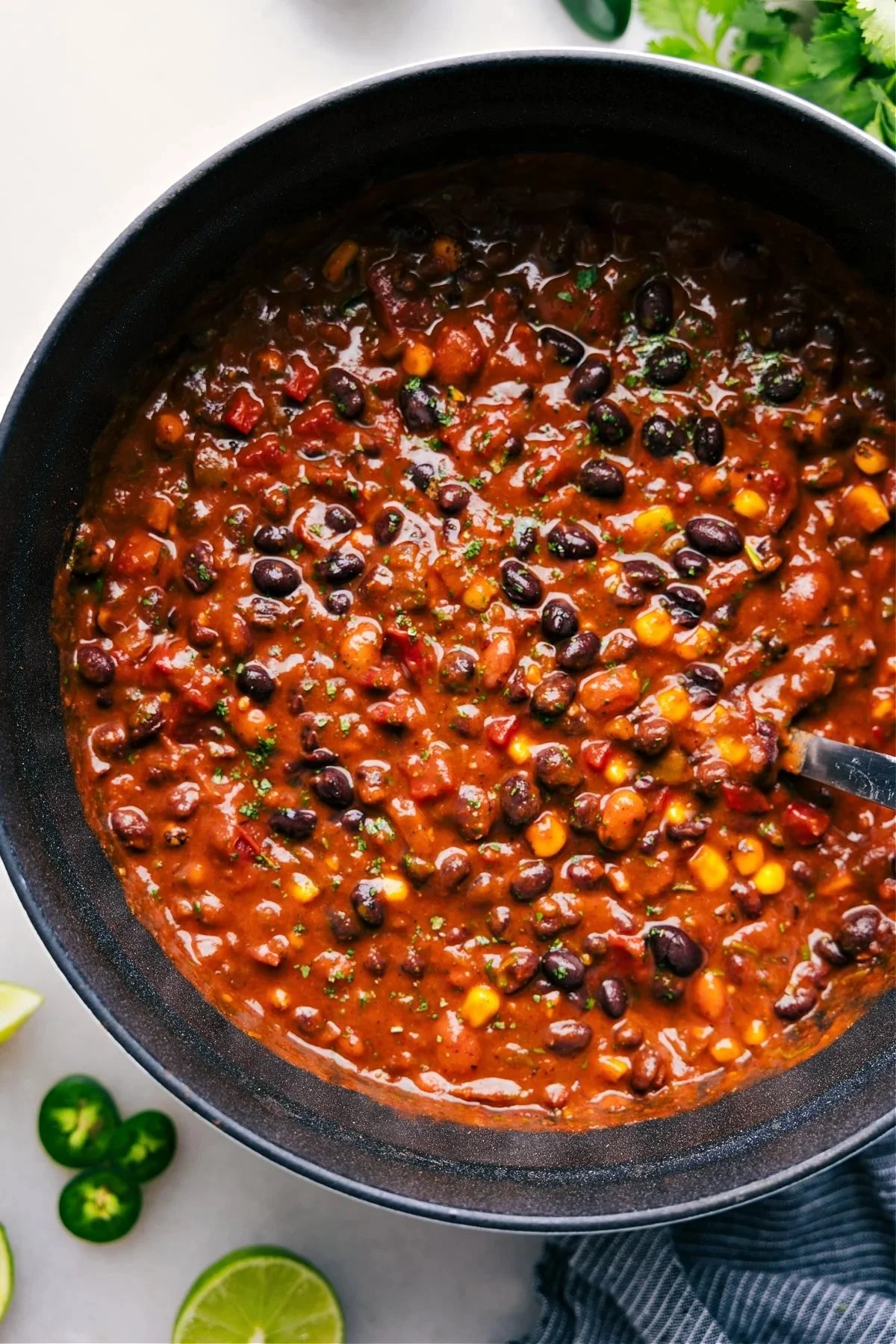Bowl of delicious Vegetarian Chili topped with fresh herbs and spices