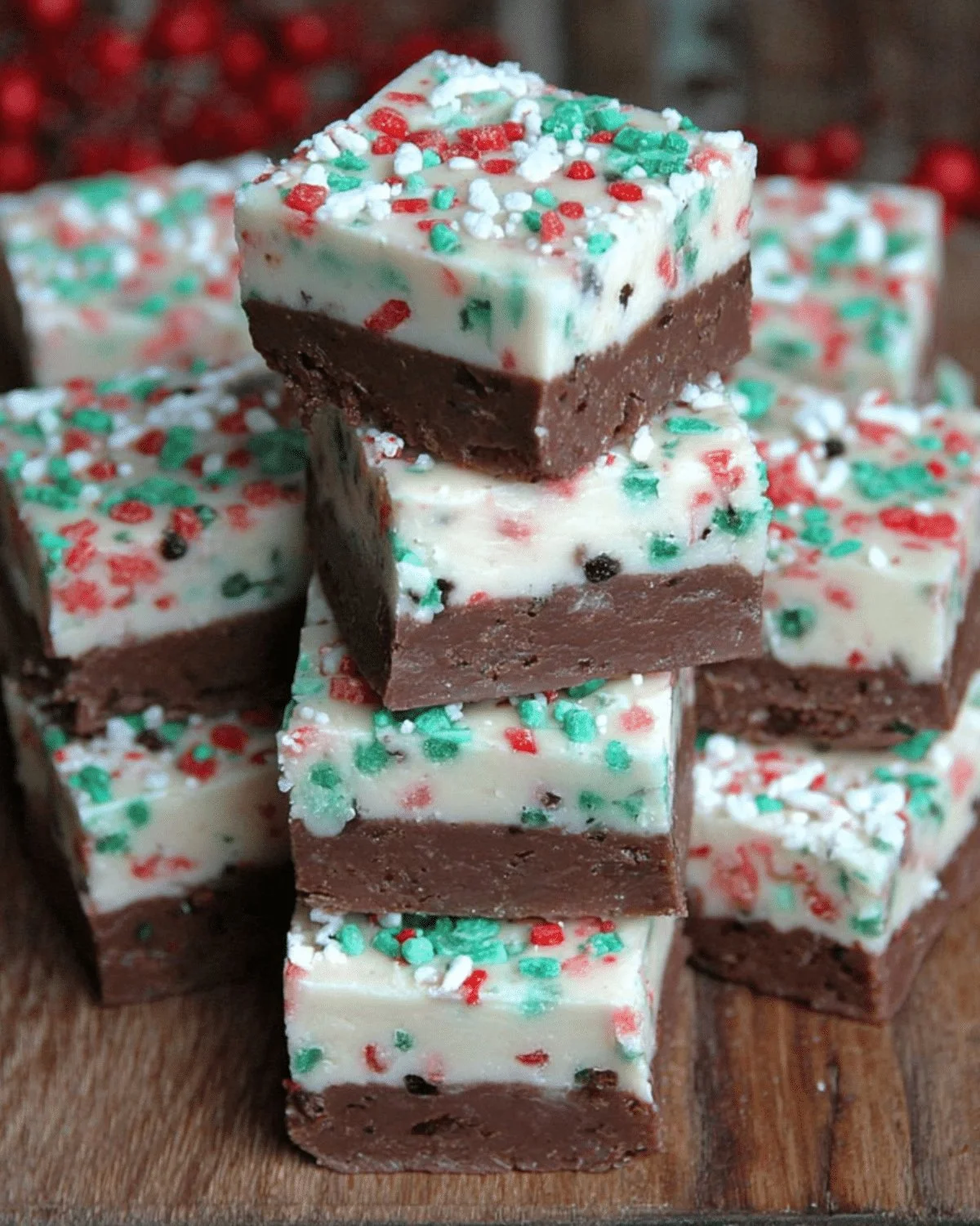 A rich and creamy Christmas Fudge displayed with festive decorations.